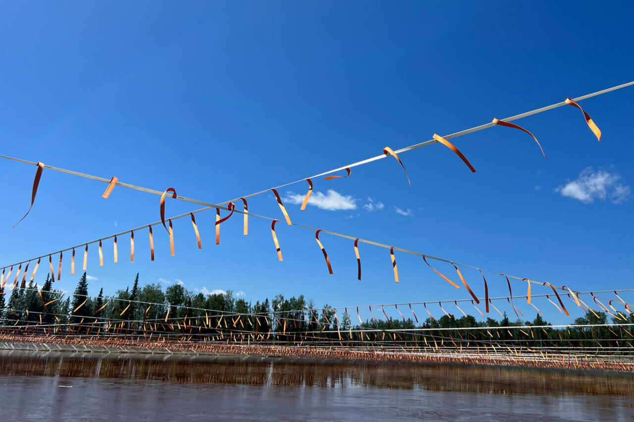 Rise Tape deterring birds from tailings pond.